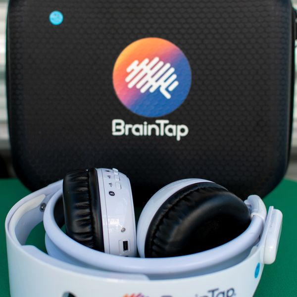 The BrainTap headset and visor resting in its case.